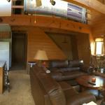 Open beam living room gives the cabin a large look.