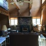 Faux stone front fireplace with wood burning insert has integrated fan forced heating.  One of the few cabins with a real chimney.