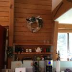 Sue made a cork and feather wreath which hangs above a creative shelf system - concrete blocks and pine 2x6s.